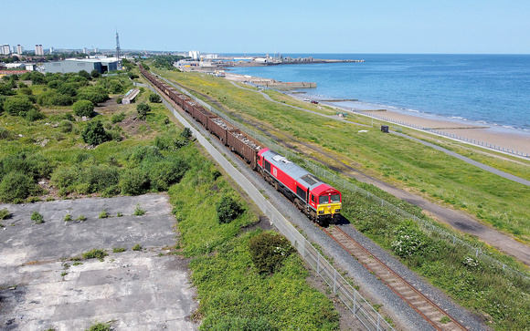 66007 heads along the Sunderland branch on 22.6.23 with 6V33 15.32 Sunderland Ward Bros to Cardiff Tidal scrap train.