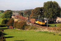 56087 heads towards Galgate on 28.9.13 with the Carlisle to Chirk logs.