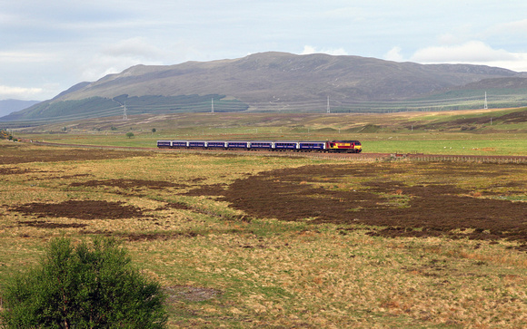 67007 heads towards Crubenmore with the Calendonian sleeper for Inverness.