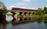 57315 heads a Doncaster to Carnforth ECS over the River Lune at Arkholme on 18.5.14.