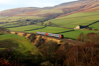 A East Midlands 158 heads down Normans Bank nr Edale on 11.12.13 with a Liverpool to Norwich service