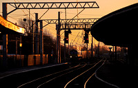 66422 heads through Carnforth with 4S44 Daventry to Coatbridge as the sun sets.