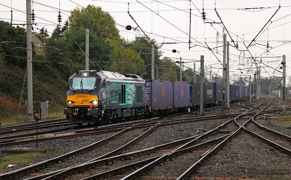 68007 passes Carnforth on 8.10.14 with 4S44 Daventry to Coatbridge in the gloom!