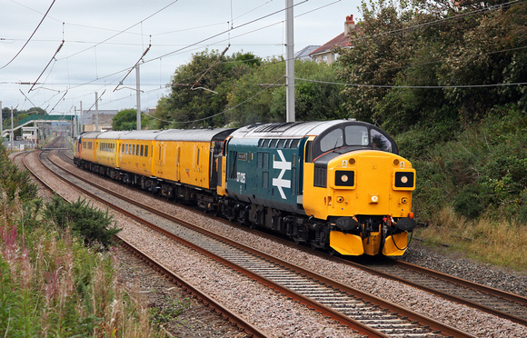 37025 TnT with 37116 pass Hest Bank with a Mossend to Derby test train on 5.9.16.