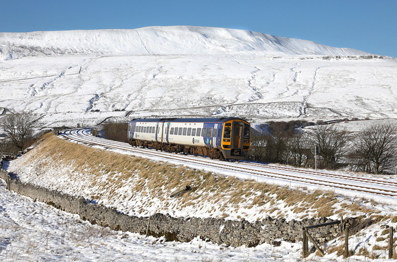 158901 approaches Ribblehead station on 18.1.24 with 2H89 10.58 Carlisle to Leeds.