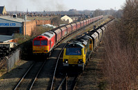 70004 pulls past 60011 as it departs Latchford Sidings with its Ellsemere to Fiddlers Ferry service.