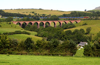 92001 heads past Beckfoot with 4S43 on 28.6.11. The disused Lowgill viaduct is in the foreground.