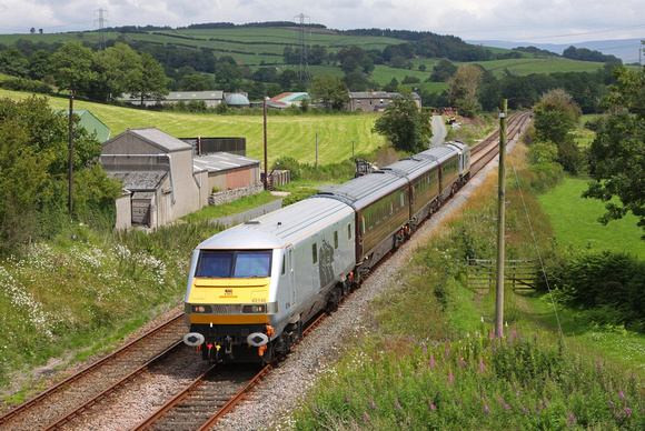 The DBS Management train heads past Keerholme with DVT 82146 leading and 67029 on the back.