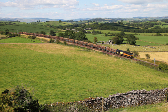 66847 heads past Hincaster with the Carlisle to Chirk logs.