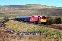 60039 heads past Ribblehead as the sun dips, with the Newbiggin to Drax Gypsum.