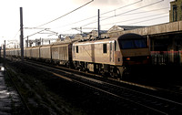 90039 heads past Carnforth on 21.12.15 with a Warrington to Shieldmuir extra Xmas Mail service.