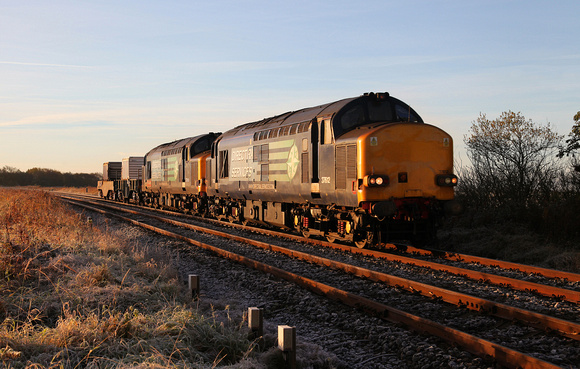 In the first rays of light 37612 & 37610 pass Silverdale crossing with 6C53 on 2.11.16.