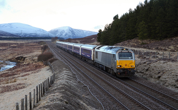 67012 heads past Wades Bridge nr Dalwhinnie with the sleeper service to Inverness on 30.4.16.