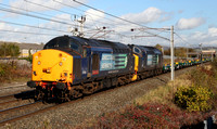 37601 &37194 pass Carnforth on 18.10.12 with a Kilmarnock to Trafford wagon move.