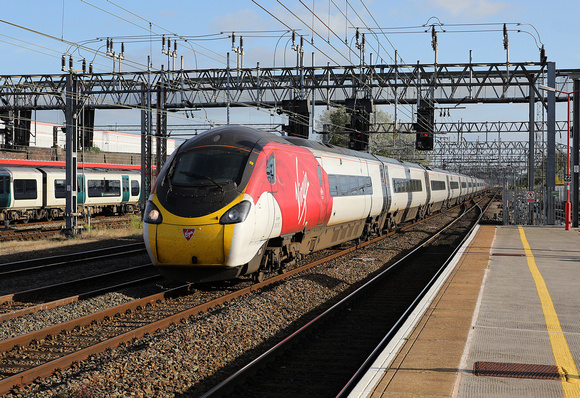 390131 heads through Crewe on the fast with a Glasgow service,