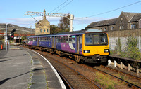 144018 approaches Carnforth with a Leeds to Morecambe service.