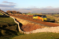 70806 heads past Greengates on 25.11.20 with the Carlisle to Chirk logs.