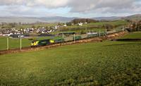 70017 heads away from Oxenholme on 2.12.20 with its Hardendale to Tunstead empties.