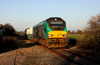 68006 heads down the Heysham branch at Peplow Rd Foot crossing with 6C51.