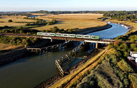 A 313 heads over the River Arun at Ford on 10.8.22 with a Littlehampton to Bognor Regis service.