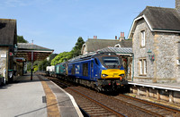 68007 & 68004 pass through Grange Over Sands on 11.5.24 with 6K73 Sellafield to Crewe.