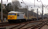 British & American Rail Services 56311 passes Carnforth with a Stoke to Motherwell wagon move.