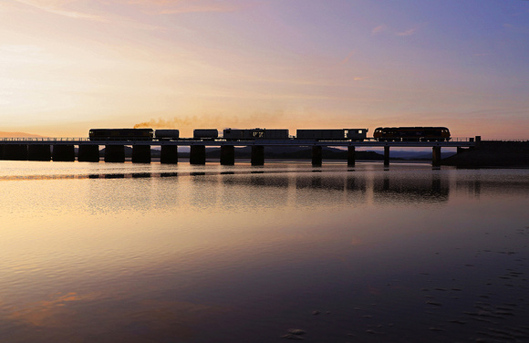 66744 & 69001 head over Arnside viaduct just after sunset on 19.6.23.