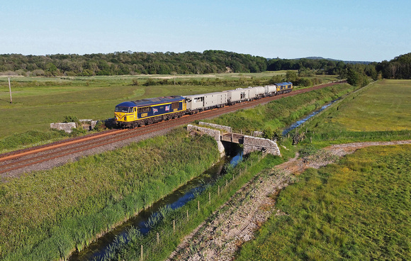 69001 & 66744 pass Black Dyke on 5.6.23 with the returning 3Q99.