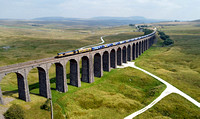 66301 works over Ribblehead Viaduct on 31.7.24 with 4N61 12.00 Drax to Tyne Coal Terminal diverted for a photoshoot, The train paused on the viaduct, gave time for the sun to shine!!