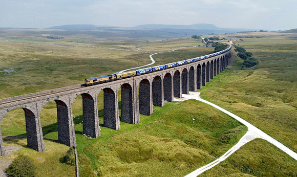 66301 works over Ribblehead Viaduct on 31.7.24 with 4N61 12.00 Drax to Tyne Coal Terminal diverted for a photoshoot, The train paused on the viaduct, gave time for the sun to shine!!