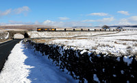 66784 passes Ribblehead  with 6M37 11.25 Arcow Quarry to Pendleton on 26.2.20