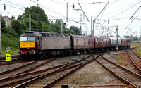 57001 departs Carnforth on 3.7.12 with the Queen of the Scots rake on a Private charter to Keith.
