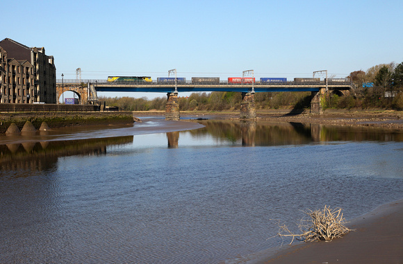 70011 heads over the River Lune on Carlisle Bridge, Lancaster with its Coatbridge to Daventry.
