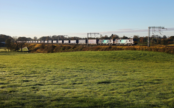 88003 & 88007 head pass Bay Horse on 27.10.17 with the Tesco Express.