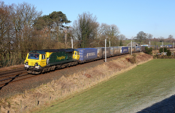 70005 heads past Hincaster with its Coatbridge to Daventry.