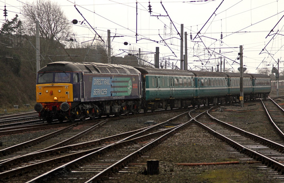 47810 departs Carnforth on 8.12.11 with 4 ex Anglia coaches for Kingmoor.