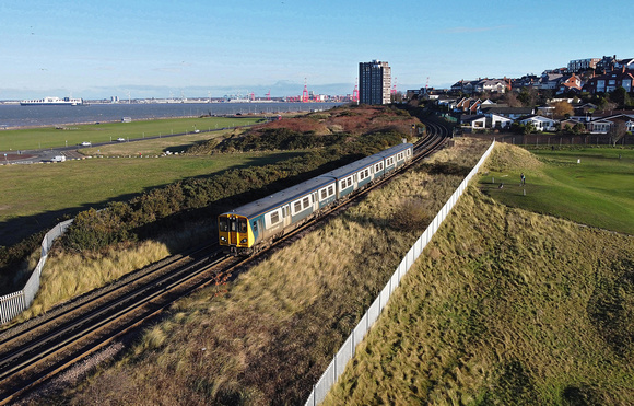 507001 heads away from New Brighton at Sandcliffe Road with 2N20 11.08 New Brighton to New Brighton.