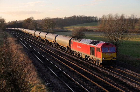 60054 passes Knabbs Bridge on 23.11.12 with a Kingsbury to Humber empty oil service.