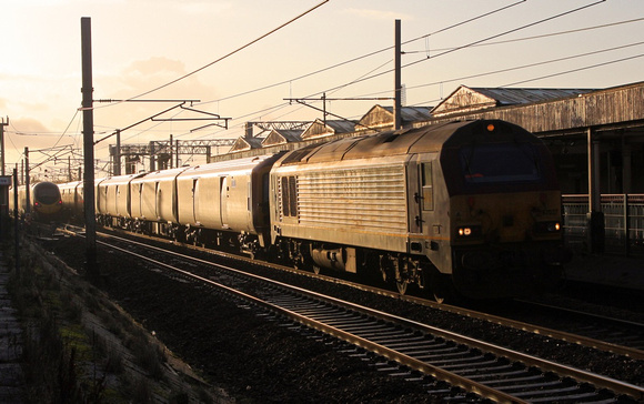 67027 passes Carnforth with 1S07 Willesden to Shieldmuir on 15.12.11.