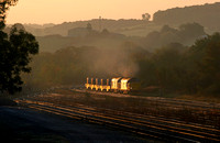 37218 & 37607 catch the first rays of light as they head away from Carnforth with 6C53.