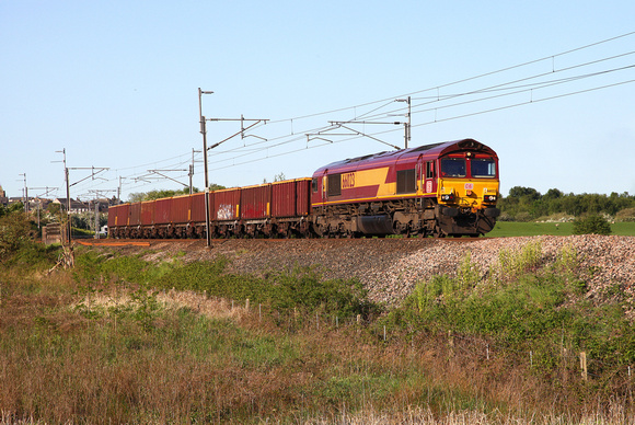 66023 heads away from Carnforth with a Doncaster to Killoch empty coal on 24.5.16.