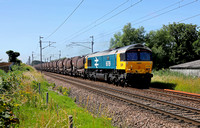 66789 heads past Bolton le Sands on 14.7.21 with 6S94 Wembley to Irvine china clays.