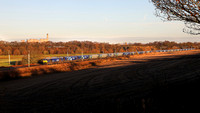60026 heads past Daresbury on 15.12.21 with 6E09 Liverpool to Drax Biomass service.