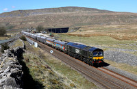 66779 passes Ribblehead on 15.4.21 with 6M38 11.25 Arcow Quarry to Bredbury .