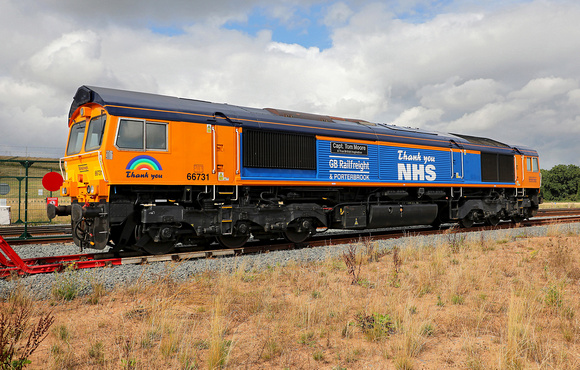 GBRF 66731 in NHS livery waits at East Midlands Gateway liner terminal on 10.9.21.