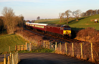 57316 heads past Starricks Farm with the Northern Belle's first run of the year. It was running ECS to York.
