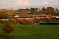 60055 passes Bay Horse in the last dregs of light with its Chaddesden to Carlisle empties.