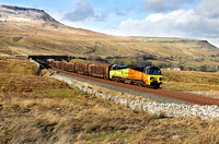 70814 climbs to Ais Gill Summit with the Chirk logs on 26.2.20