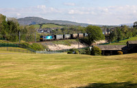 88001 heads away from Carnforth with 4M27 Mossend to Daventry.