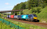 88007 passes Beckfoot with the Tesco Express on 24.6.20